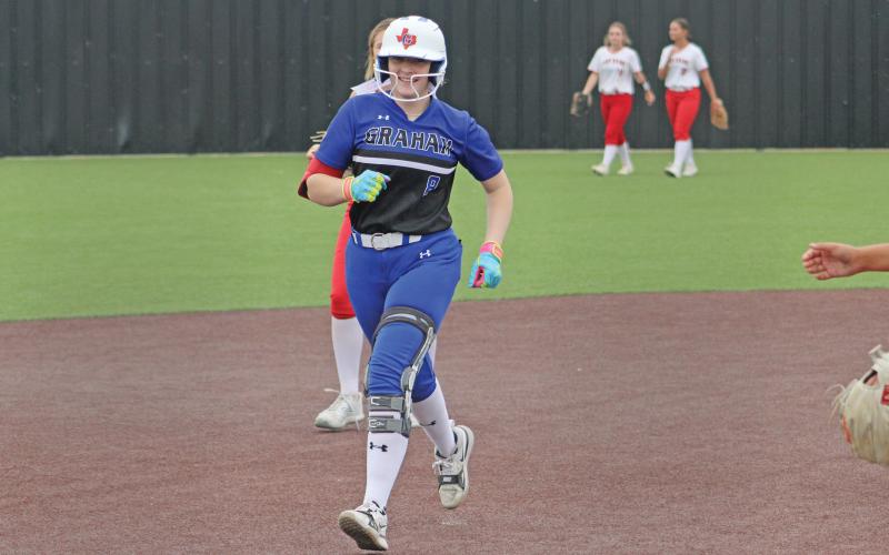 (ALEX HAVARDANSKY | THE GRAHAM LEADER) Zoey Harrell rounds the bases after hitting a walk off home run against the Mineral Wells Lady Rams. Harrell had her signature moment Friday, April 18 as the lone senior for the team. 