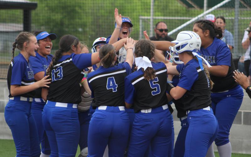 (ALEX HAVARDANSKY | THE GRAHAM LEADER) The Lady Blues separated after clinching a playoff berth Friday, April 18. The Lady Blues will look to have another strong season in 2026. 