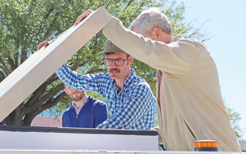 (THOMAS WALLNER | THE GRAHAM LEADER) River McTasney shows off the Ranch Rover autonomous vehicle Wednesday, April 3 to Graham Economic Improvement Corporation Board of Directors Chair Jack Graham.