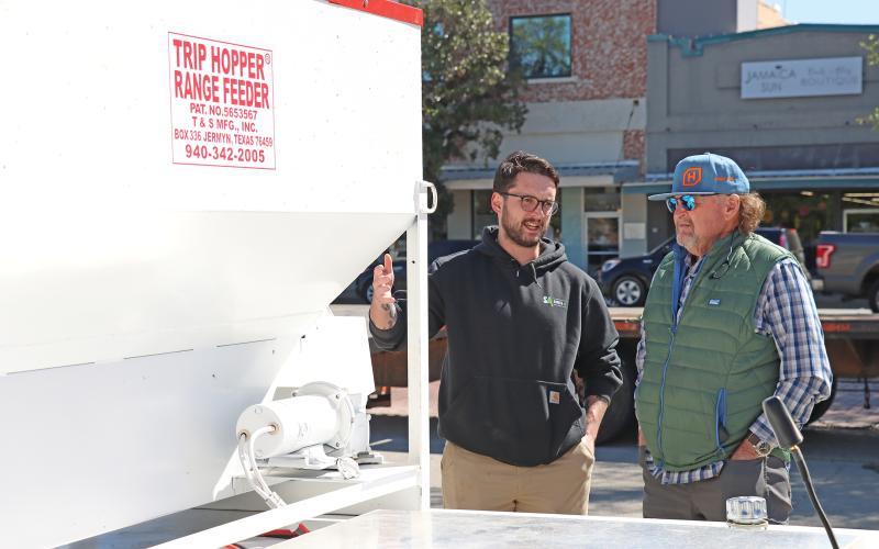 (THOMAS WALLNER | THE GRAHAM LEADER) Jay Jones (left) with Smooth Ag speaks to Graham City Council Member Jack Little about the features of the Ranch Rover autonomous vehicle. 