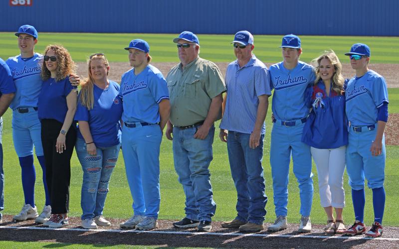 (ALEX HAVARDANSKY | THE GRAHAM LEADER) Thompson and Johnson Alongside Taylor who was the final senior honored at senior day.