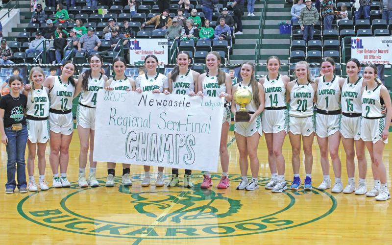 (ALEX KIELAR | BRECKENRIDGE AMERICAN) The Ladycats pose with their trophy as they celebrate being named the regional semi-final champions after their Tuesday, Feb. 18 win over May.