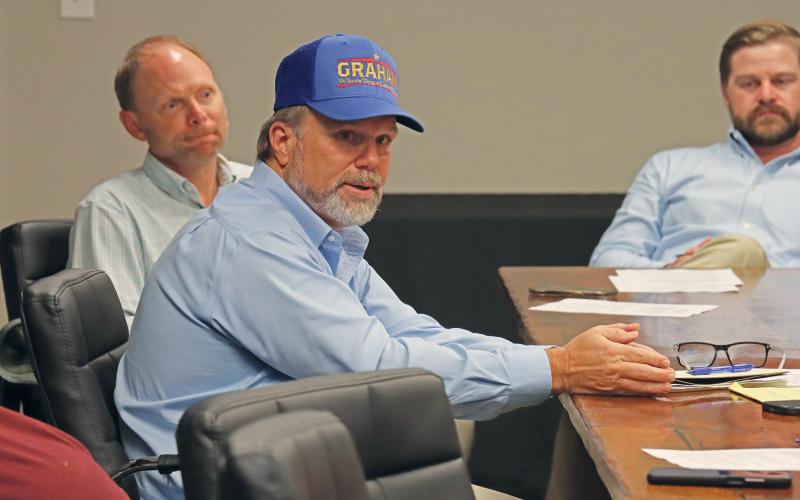 (THOMAS WALLNER | THE GRAHAM LEADER) City Manager Eric Garretty speaks to the Downtown Development District 1 board during their meeting Tuesday, Sept. 3. Shown from left to right are board member Brendan Weatherman, Garretty and Assistant City Manager Grant Ingram.