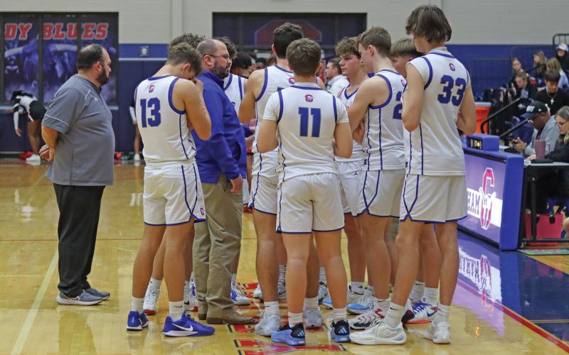 (THOMAS WALLNER | THE GRAHAM LEADER) Head coach Kyle Wood speaks with the Steers during a timeout. The Graham team came back time and time again against Mineral Wells and pulled away with a 54-40 win Friday, Jan. 17.
