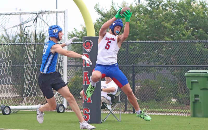(TC GORDON | THE GRAHAM LEADER) Senior receiver Harison Brockway (5) makes a leaping catch in the end zone and looks to keep his feet inbounds as he scores a touchdown during one of Graham’s 7on7 games in Mineral Wells last Saturday, May 25.