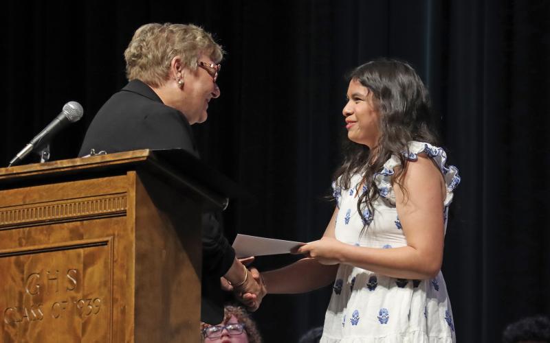 (THOMAS WALLNER | THE GRAHAM LEADER) Cookee Johnson presents the Delta Kamma Gamma Scholarship to Graham High School senior Hailey Fuentes during the GHS Scholarship Awards Ceremony held Monday, April 28.