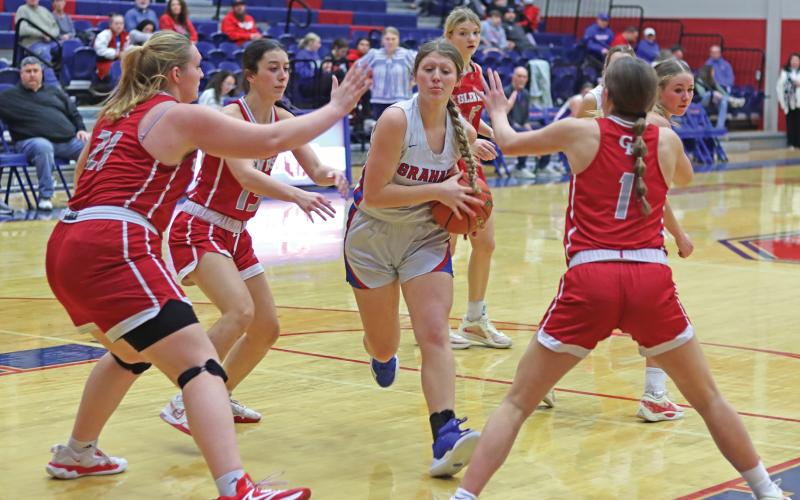 (THOMAS WALLNER | THE GRAHAM LEADER) Briley Randall pushes her way through a trio of Glen Rose defenders Friday, Jan. 24 as she attempts to set up a shot at the basket. Despite a late-game attempt by the Lady Blues to push ahead, the team fell 35-57.