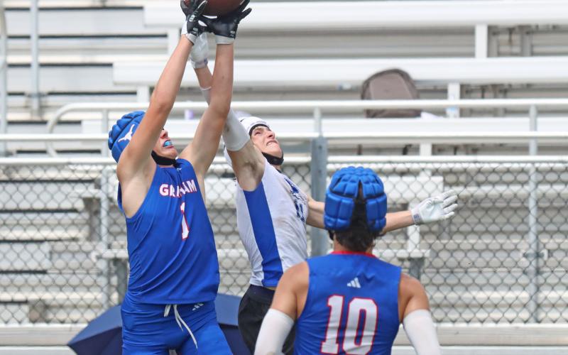 (TC GORDON | THE GRAHAM LEADER) Sophomore Cooper Corley (1) battles with a Peaster receiver for a ball that Corley ultimately intercepted during one of Graham’s 7on7 games at the Mineral Wells State Qualifying Tournament this past Saturday, May 25. The Steers finished the day a perfect 3-0 in pool play after qualifying for the state tournament in their first competition the week before.