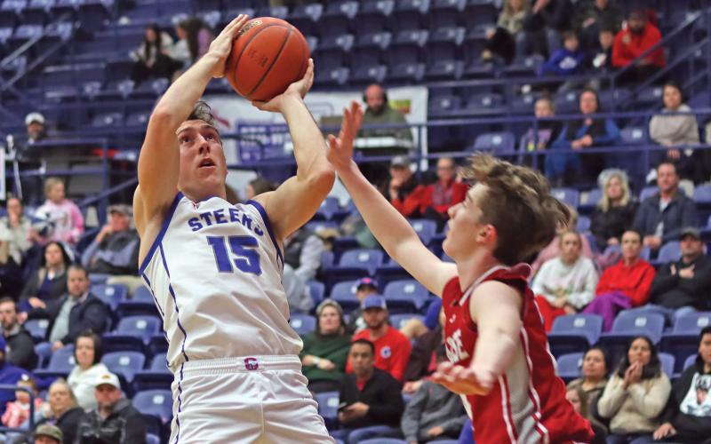 (THOMAS WALLNER | THE GRAHAM LEADER) Ty Thompson leans back to make a shot at the basket during the game Tuesday, Jan. 21 against Glen Rose. Thompson led in scoring for the team with 18 points, 16 of which were in the second half of the game.