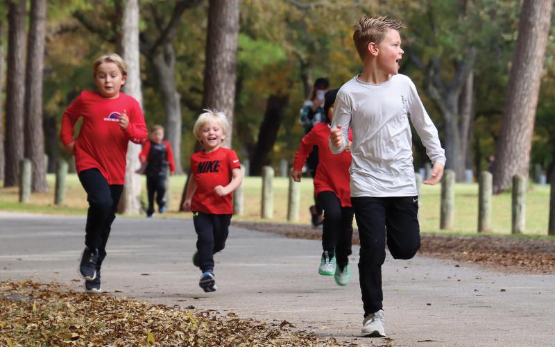 (ARCHIVE PHOTO | THE GRAHAM LEADER) Runners approach the finish line at the Spivey Hill Challenge in 2023 at Firemen’s Park. The event this year will be held at 9 a.m. Saturday, Nov. 9 with a virtual and in-person 5K, 1K Fun Run and the Walk & Talk.