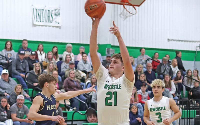 (THOMAS WALLNER | THE GRAHAM LEADER) Jayden Hemby of the Bobcats jumps to make a shot at the free throw line Friday, Jan. 24. Hemby led in scoring for the team with 13 points during the game against Perrin.