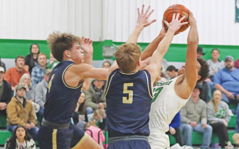 (ARCHIVE PHOTO | THE GRAHAM LEADER) Jacob Omundi fights to make a shot at the net at a game last season for the Bobcats. Omundi continues to be a force for the team this year.