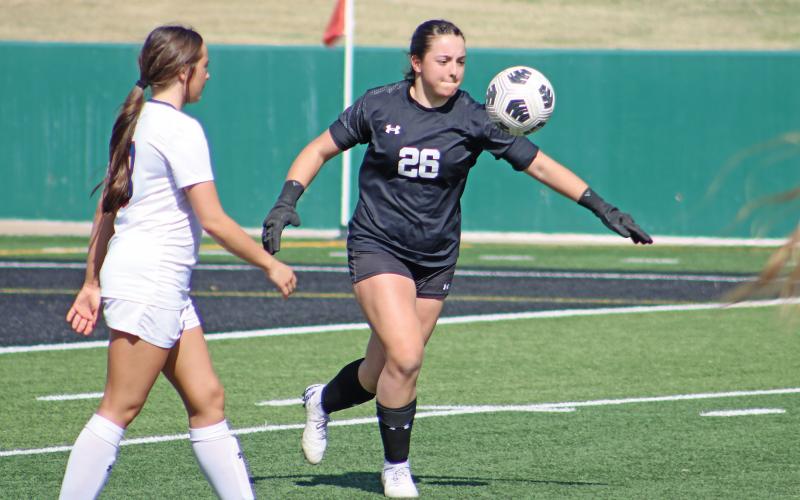 (ALEX HAVARDANSKY | THE GRAHAM LEADER) Taylor Lauster clears the ball to the Lubbock Liberty Patriots side of the field during their match up on Tuesday March, 25. Lauster accounted for seven defensive stops in the first half against Lubbock while also being a stabilizing force during the teams first round matchup against Borger.