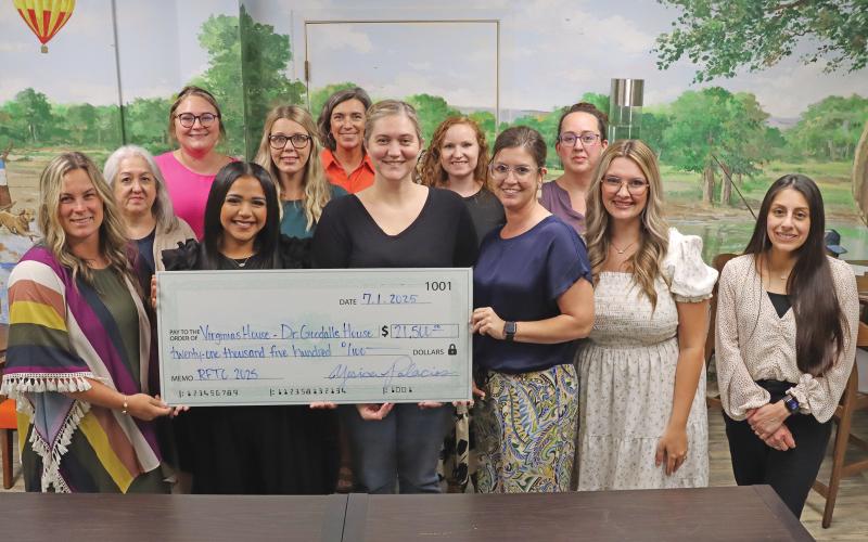 (ARCHIVE PHOTO | THE GRAHAM LEADER) Members of Virginia’s House accepted a $21,500 check from the Run for the Children board July 1, 2025 from proceeds raised from the run and auction. Last year’s event celebrated 20 years in Graham, with over $230,000 raised since its establishment.