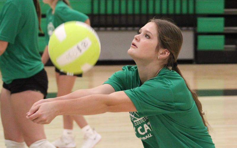 (ALEX HAVARDANSKY | THE GRAHAM LEADER) Newcastle’s Camren Mallory sets a ball at volleyball team camp Tuesday, July 29. Ladycats head coach Ashley Archer said fundamentals like setting were worked on heavily at two-a-day practices.