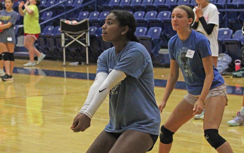 (ALEX HAVARDANSKY | THE GRAHAM LEADER) Lady Blues eighth and ninth grade campers work on defending serves at volleyball camp Tuesday, July 29. This was a two sided drill with one team being the serving team and the other being the defensive team. 