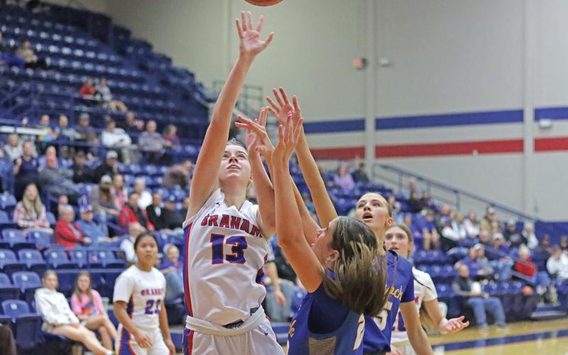 (LIAM BAILEY | THE GRAHAM LEADER) Fayth Bryer jumps at the net to put points on the board Tuesday, Jan. 28 for the Lady Blues. The Graham team had a rematch against Brock at home and fell 26-46.