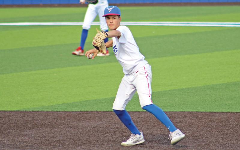 (ALEX HAVARDANSKY | THE GRAHAM LEADER) The infield warming up for the latter portions of their Friday, March 28 matchup against the Brock Eagles.