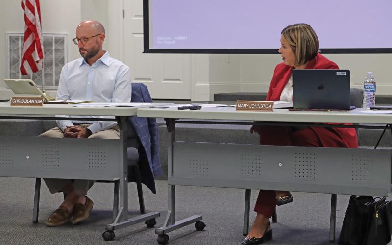 (THOMAS WALLNER | THE GRAHAM LEADER) Graham ISD Superintendent Mary Johnston speaks Wednesday, Aug. 6 with the GISD Board of Trustees regarding changes to the personal communication device policy for the district. Shown from left to right are Board President Chris Blanton and Johnston.