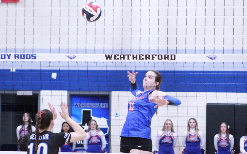 (TC GORDON | THE GRAHAM LEADER) Junior Lillian Noble leaps up and prepares to kill the ball for a point during Graham’s area round matchup against Decatur. The Lady Blues put up a fight but lost in three sets to end their season.