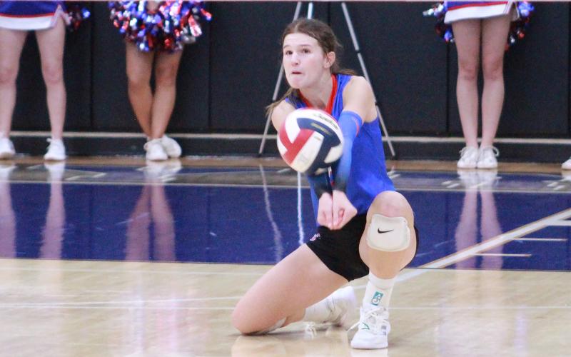 (TC GORDON | THE GRAHAM LEADER) Sophomore Tara Dawson digs a ball out that was hit by one of Decatur’s players. Graham lost to Decatur in three sets in the area round of the playoffs which ended the team’s season.