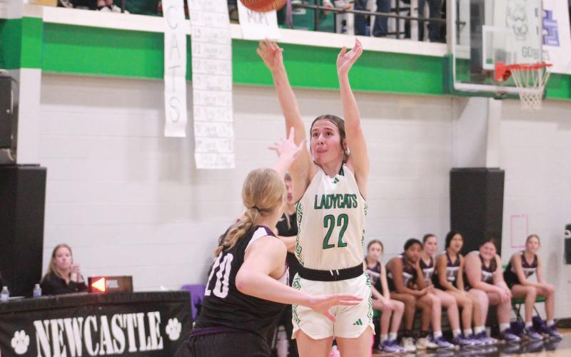 (ARCHIVE PHOTO | THE GRAHAM LEADER) Newcastle’s Mattie Dollar shoots a jump shot over a Throckmorton defender during a game last season. Dollar continues to be a strong force for the team this season, leading in points Friday, Dec. 20 against the Mineral Wells Lady Rams.