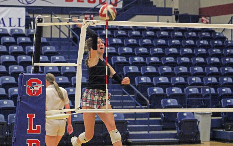 (ALEX HAVARDANSKY | THE GRAHAM LEADER) Graham’s Katy McGehee, practices hitting during midnight madness Friday, Aug. 1. The team worked on basic fundamentals before transitioning into team scenarios during their first two-a-day practice.