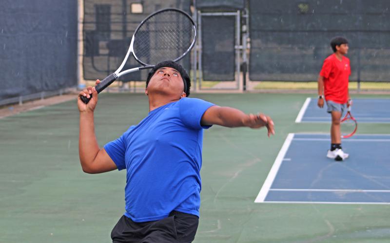 (ALEX HAVARDANSKY | THE GRAHAM LEADER) Chris Reyes at the service line Friday, Aug. 1. Reyes was a star in his double match with Tyler Bryan capping his performance with a behind the back swing.