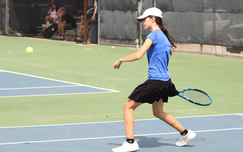 (ALEX HAVARDANSKY | THE GRAHAM LEADER) Stacy Gonzalez takes a swing in her singles match Friday, Aug. 1. Gonzalez won her first singles match of the year 8-0. 