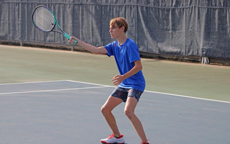 (ALEX HAVARDANSKY | THE GRAHAM LEADER) Raife Bishop swings at ball Saturday, Aug. 2, against Krum. Bishop had his best performance of the season so far against Stephenville picking up an 8-1 in his singles match.