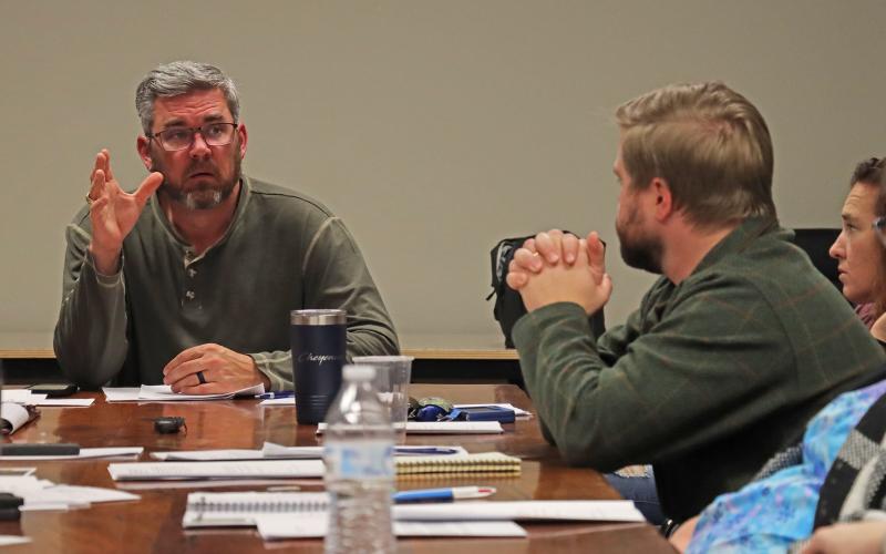(THOMAS WALLNER | THE GRAHAM LEADER) Graham Parks Department Board of Directors Chairman Alex Heartfield (left) speaks with the board during a meeting held Tuesday, Dec. 12. The city was updated on multiple projects during the meeting.