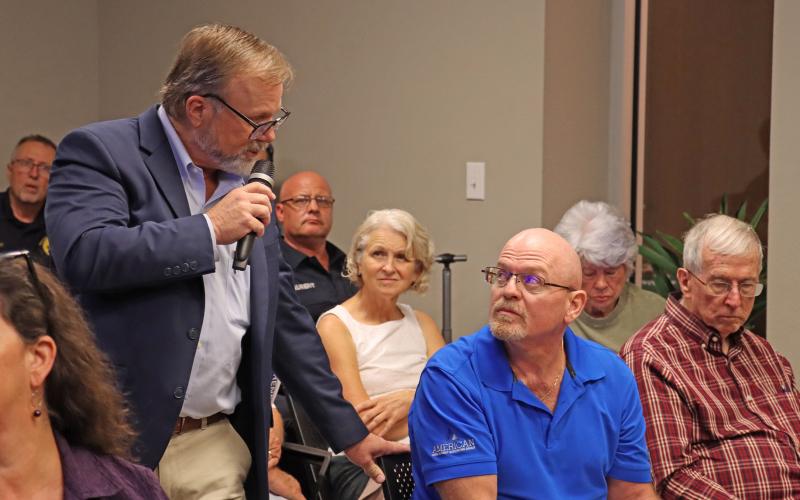 (THOMAS WALLNER | THE GRAHAM LEADER) Graham City Manager Eric Garretty answers a question from Graham resident Greg Bonzelaar during a town hall meeting Tuesday, Aug. 26. Members of the public spoke at the meeting Tuesday and voiced concerns regarding a number of city topics.
