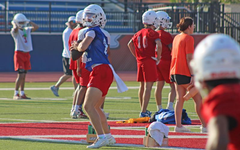 (ALEX HAVARDANSKY | THE GRAHAM LEADER) Steers quarterback Jace Gill looks for his receiver in passing drills Tuesday, Aug. 5. Gill takes over the spot Ty Thompson held as the leader of the team this season.
