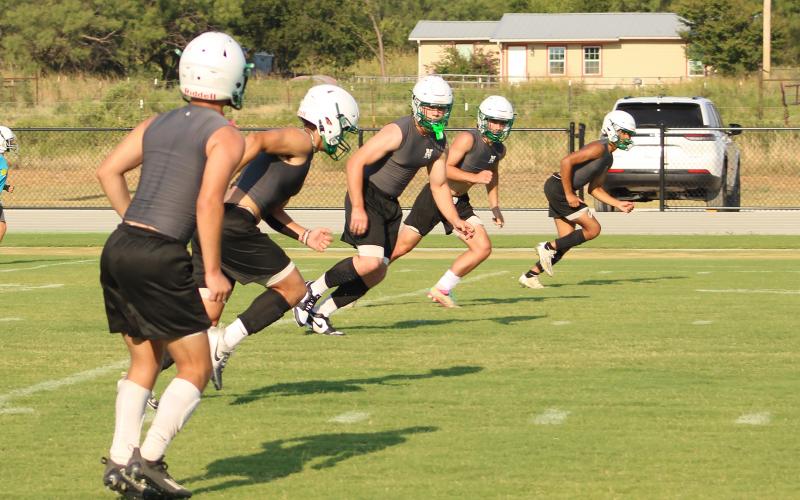 (ALEX HAVARDANSKY | THE GRAHAM LEADER) The Bobcats special teams unit works on their coverage on kick-offs Tuesday, Aug. 5. Bobcats head coach Isiah Archer said it's enjoyable watching players pick up new skills and add to their arsenals each year.