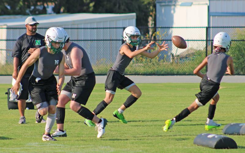 (ALEX HAVARDANSKY | THE GRAHAM LEADER) The Bobcats practice offensive drills at two-a-days Tuesday, Aug. 5. In this drill the runningback who is being thrown the ball can either take it and run or turn it into a passing play. 