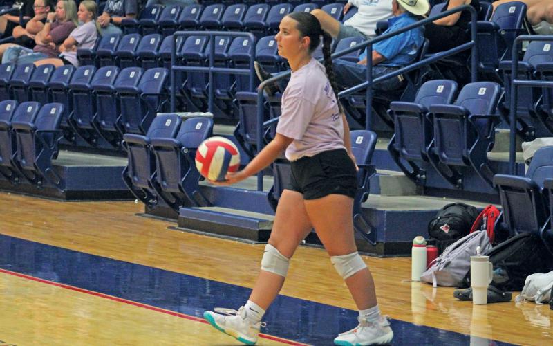 (ALEX HAVARDANSKY | THE GRAHAM LEADER) Newcastle’s Emma Hawkins prepares to serve during the Graham summer league Monday, June 24, 2024. Newcastle is holding one final volleyball camp before the regular season Monday and Tuesday, July 28-29.