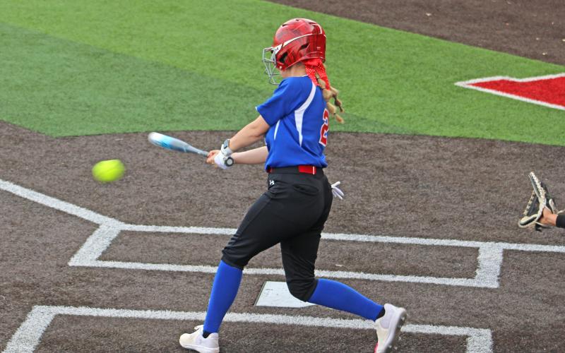 (ALEX HAVARDANSKY | THE GRAHAM LEADER) Kloe Hammond makes solid contact with the ball while up to bat for the Lady Blues in the top of the first inning of their game Tuesday, April 1. Coach Kasey Williams said getting a feel for the pitcher was critical in eventually breaking through offensively. 