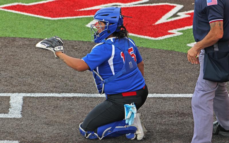 (ALEX HAVARDANSKY | THE GRAHAM LEADER) Gabriella Reyes stationed behind home plate at catcher for the Lady Blues during their matchup Tuesday, April 1. Reyes would also spend time platooning at third base later in the game.