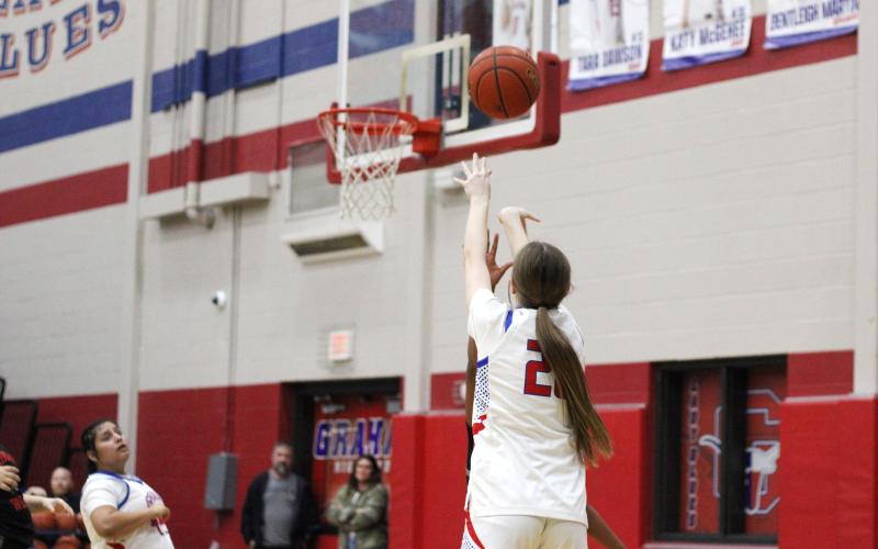 (ALEX HAVARDANSKY | THE GRAHAM LEADER) Katy McGehee shoots a three pointer Tuesday, Feb. 10 against the Mineral Wells Lady Rams. McGehee was effective at getting to the basket in the Lady Blues’ 45-35 win.