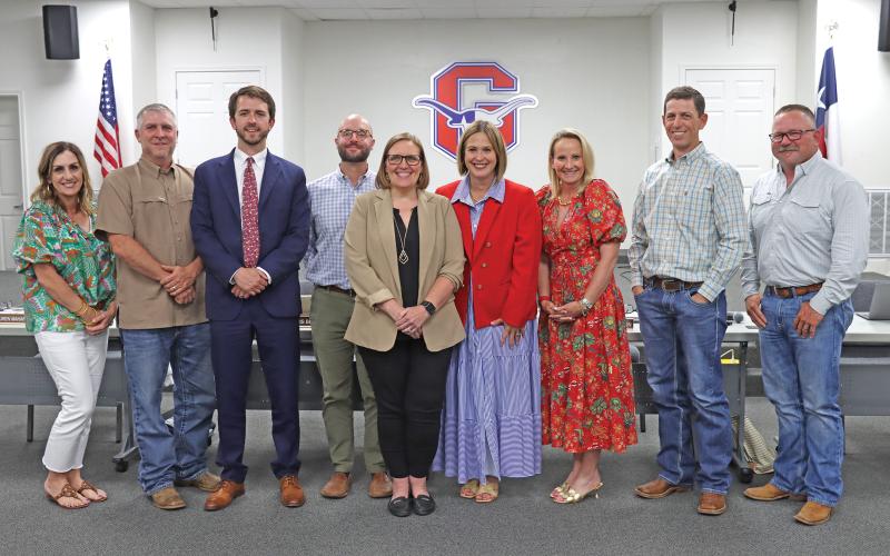 (THOMAS WALLNER | THE GRAHAM LEADER) Woodland Elementary School Principal Audra Barrett was hired as the new Graham Junior High School Principal after approval Wednesday, May 14 from the Graham ISD Board of Trustees. Shown from left to right are Lauren Mahaney, Brandon Bates, John Brown, Chris Blanton, Barrett, Dr. Mary Johnston, Kristina Pettus, Brandon Joy and Jason Smith.