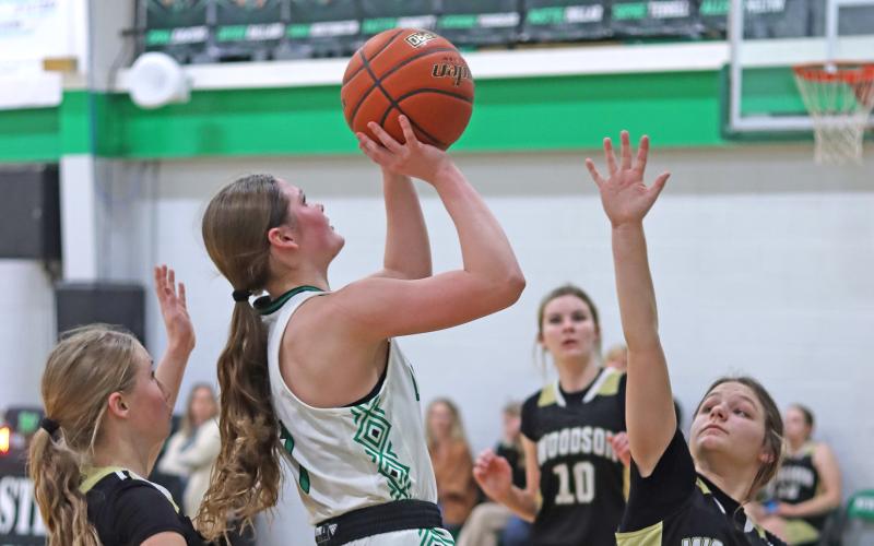 (THOMAS WALLNER | THE GRAHAM LEADER) Camren Mallory lines up a shot at the basket for the Ladycats during their game Tuesday, Feb. 4 against Woodson. The Ladycats are on 15-game winning streak and with the victory were perfect in district.