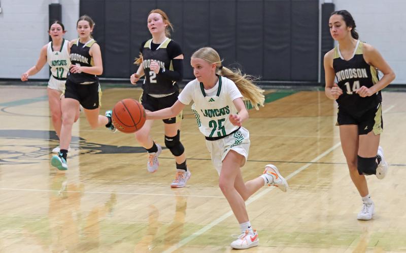 (THOMAS WALLNER | THE GRAHAM LEADER) Allison Melton runs down the court to make a play Tuesday, Feb. 4 in the game against Woodson. The Ladycats came out on top and finished with a perfect 7-0 record in district.