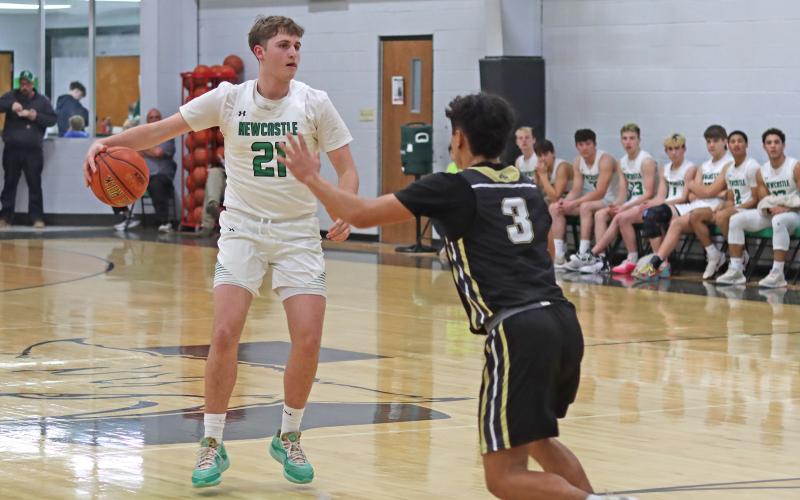 (ARCHIVE PHOTO | THE GRAHAM LEADER) Jayden Hemby looks for an open teammate during the Newcastle game against Woodson last season. The Bobcats opened their season with a three-day tournament from Thursday, Dec. 4 through Saturday, Dec. 6.