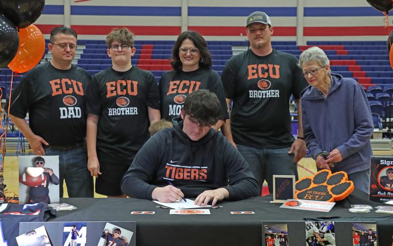 (THOMAS WALLNER | THE GRAHAM LEADER) Pavlo Prenushi signs to play football for East Central Texas University during a Graham High School athletes signing ceremony Wednesday, Feb. 5.