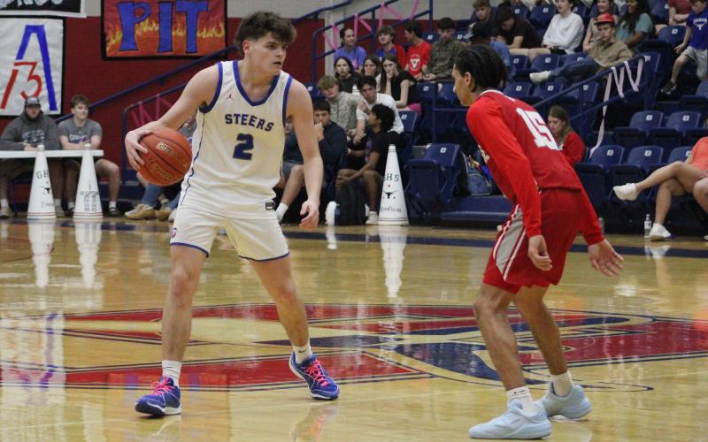 (ALEX HAVARDANSKY | THE GRAHAM LEADER) Bryce Martin one on one with a defender Friday, Feb. 13 against the Glen Rose Tigers. Martin was the second leading scorer in the game for the Steers with nine points. 