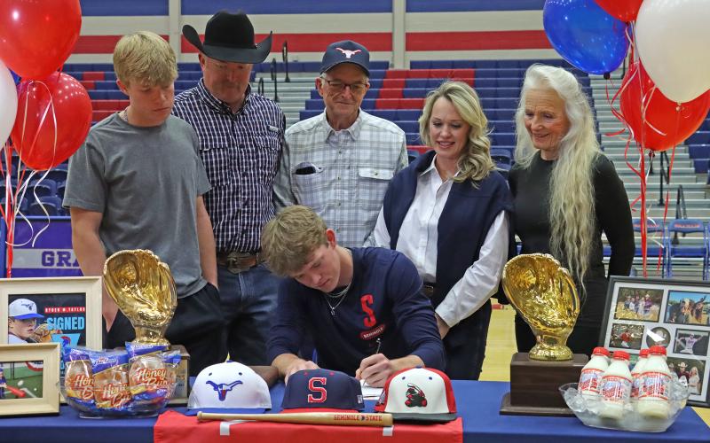 (THOMAS WALLNER | THE GRAHAM LEADER) Ryder Taylor signs to play baseball for Seminole State College in Oklahoma during a Graham High School athletes signing ceremony Wednesday, Feb. 5.
