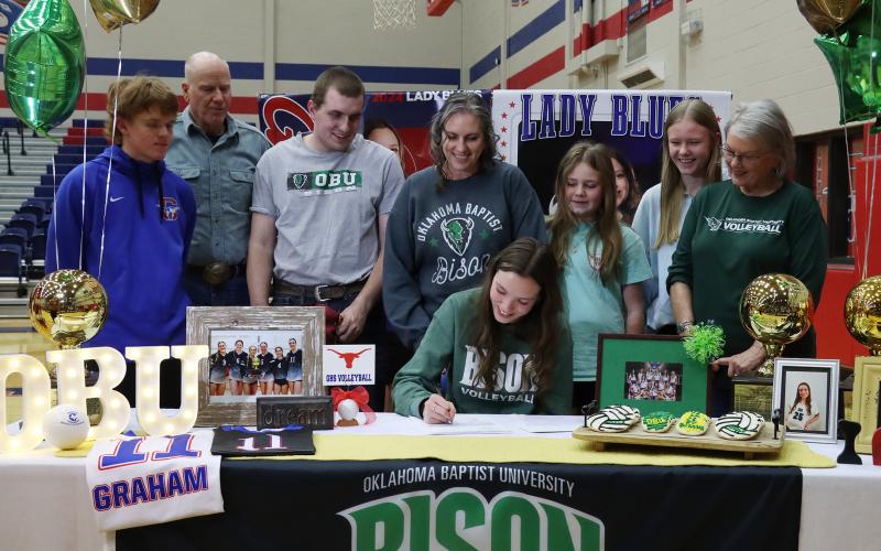 (THOMAS WALLNER | THE GRAHAM LEADER) Lillian Noble signs to play volleyball for Oklahoma Baptist University during a Graham High School athletes signing ceremony Wednesday, Feb. 5.