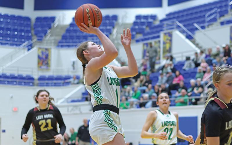 (THOMAS WALLNER | THE GRAHAM LEADER) Camren Mallory makes a shot during the Ladycats bi-district matchup Monday, Feb. 10. Among other accolades, Mallory was named All District Defensive Player of the Year for her Ladycats basketball season performance.