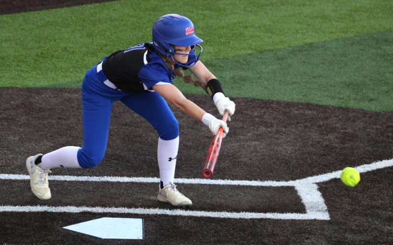 (ALEX HAVARDANSKY | THE GRAHAM LEADER) Jansyn Louder bunts the ball Tuesday, Feb. 17 against the Alvord Lady Bulldogs. Louder laid down a key bunt in the first inning in the first inning to put runners in scoring position in the 9-1 victory. 