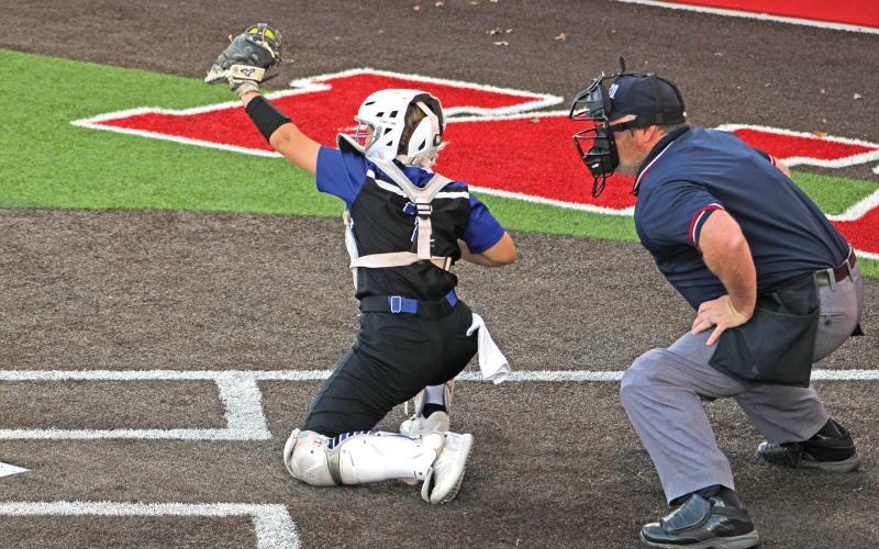 (ALEX HAVARDANSKY | THE GRAHAM LEADER) Kylie Pruitt behind the dish at catcher for the Lady Blues in their Tuesday, April 1 matchup against the Lady Rams. Pruitt was very versatile in their victory calling a great game behind home plate while also delivering the games biggest hit. 